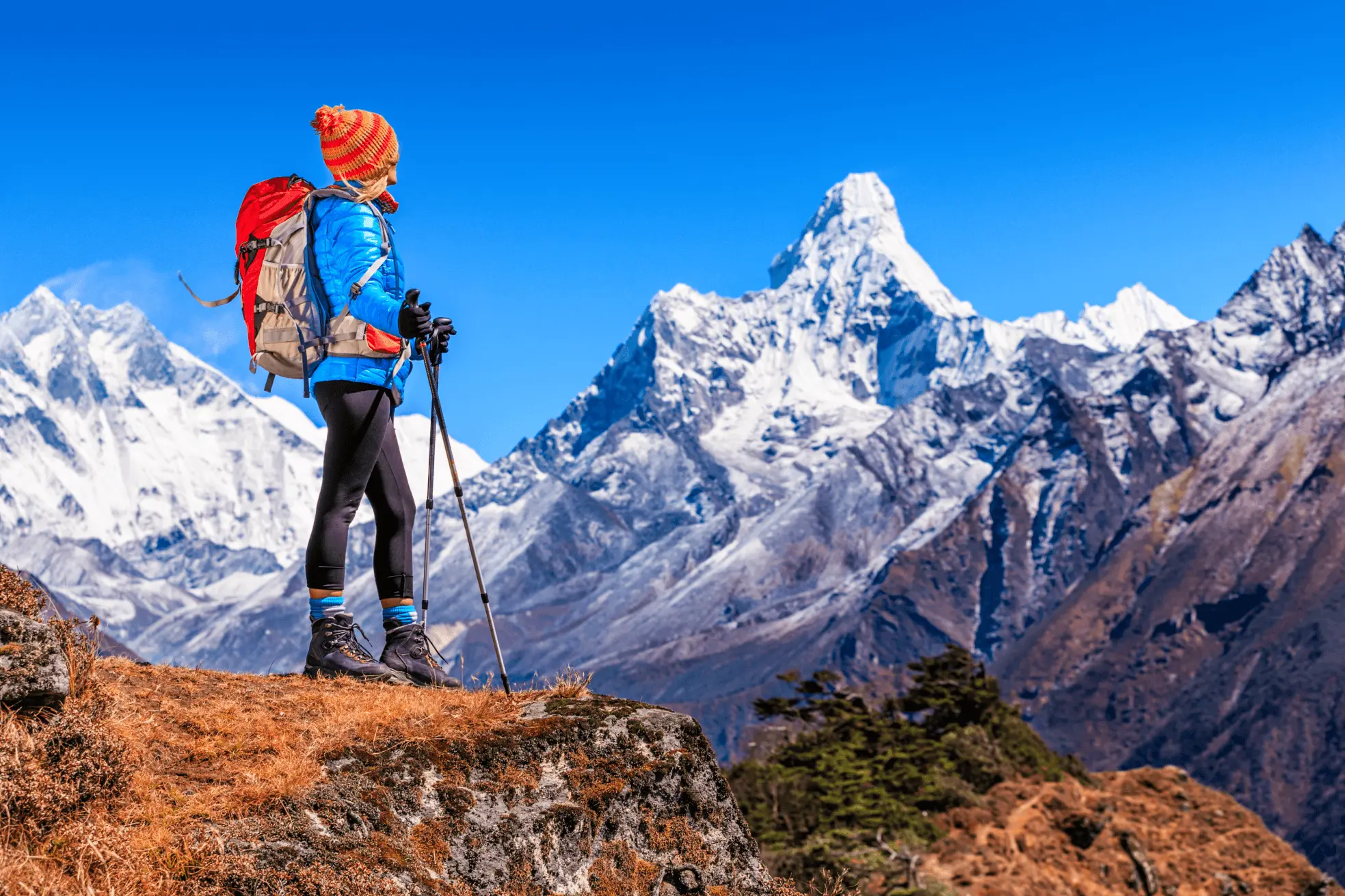 Nepal trekking adventure — hiker on mountain trail with scenic Himalayan landscape